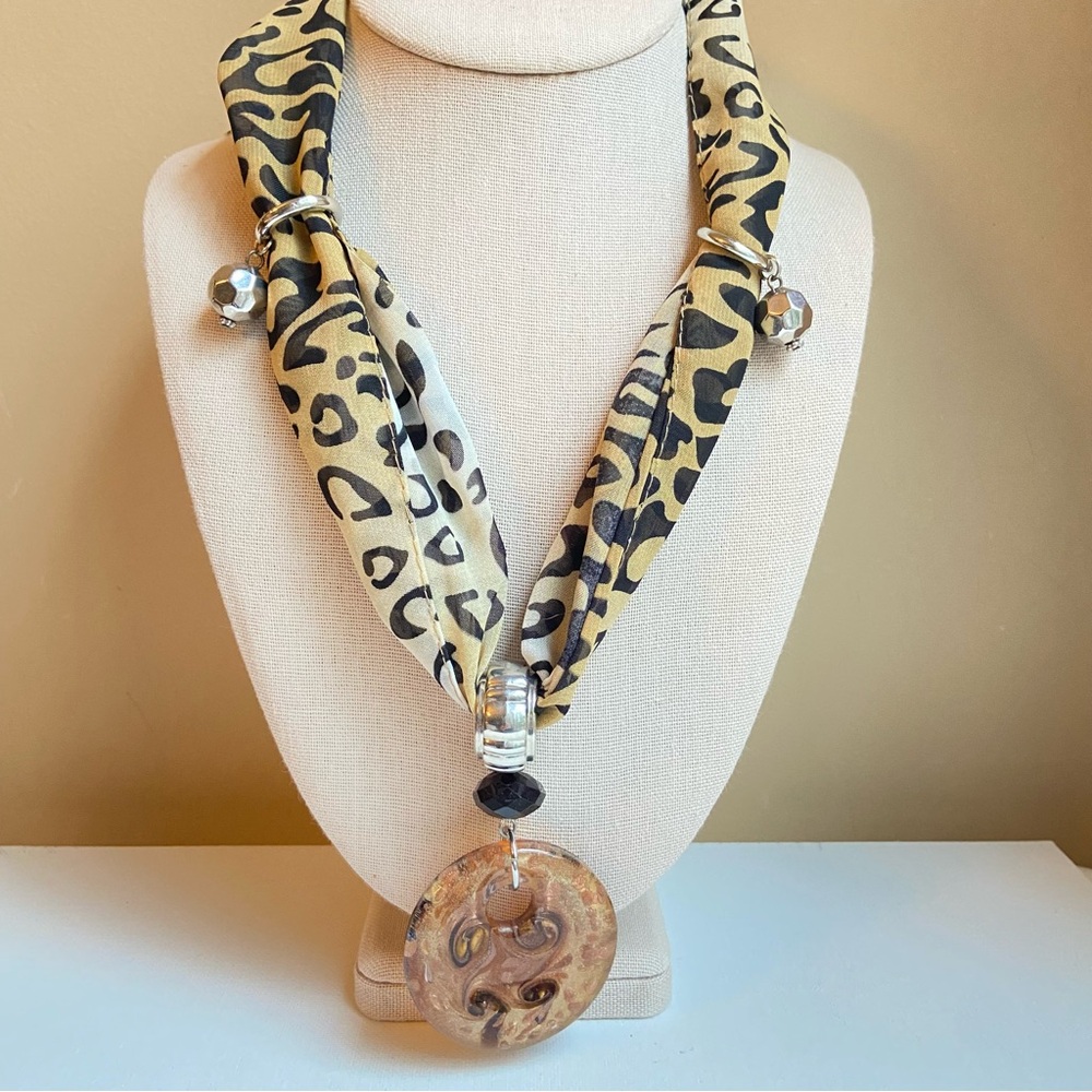 Erica Lyons animal print scarf necklace with a sparkly brown art glass pendant